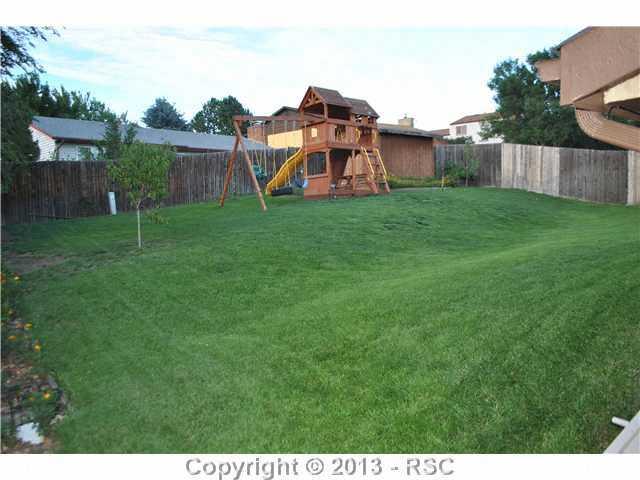 5160 Solar Ridge Drive Colorado Springs, CO 80917 - Photo 25 of 25 Backyard view in the summer