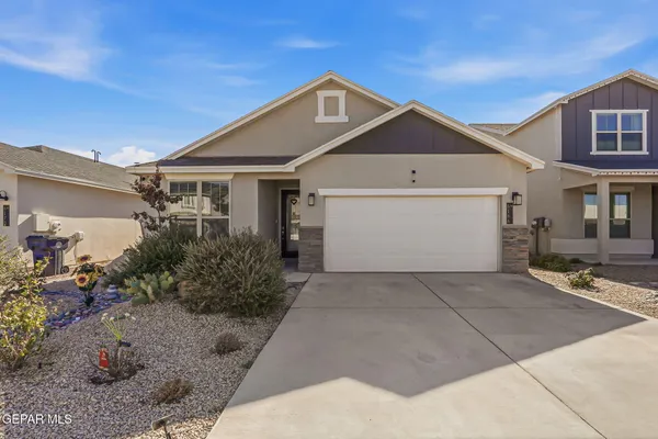 a front view of a house with yard