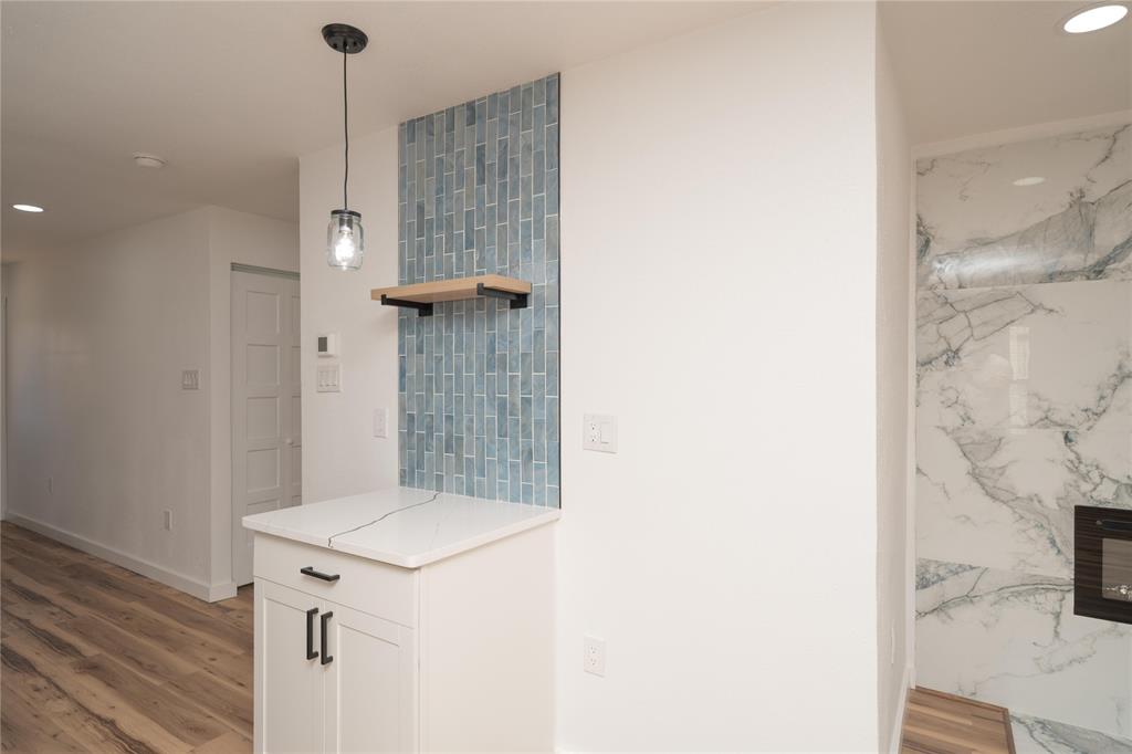 312 North Retta Street Fort Worth, TX 76111 - Photo 12 of 30 a bathroom with a sink and a mirror