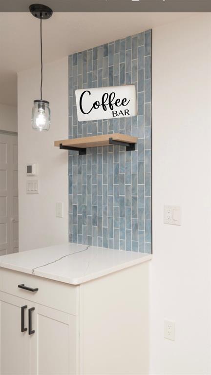 312 North Retta Street Fort Worth, TX 76111 - Photo 13 of 30 a bathroom with a sink and a mirror