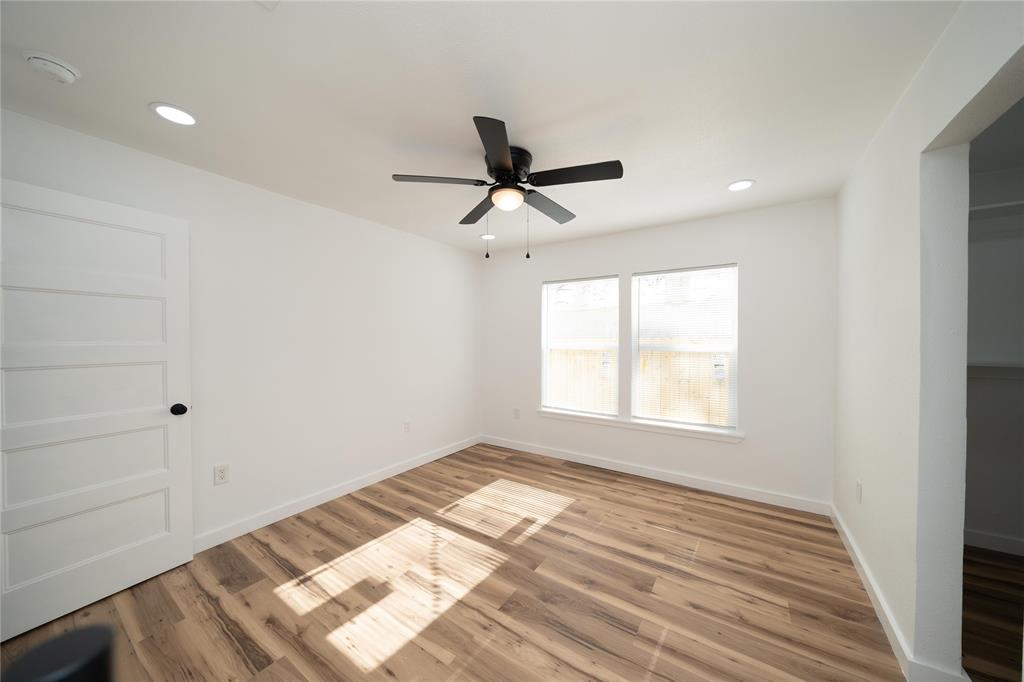 312 North Retta Street Fort Worth, TX 76111 - Photo 23 of 30 a view of an empty room and window and a ceiling fan