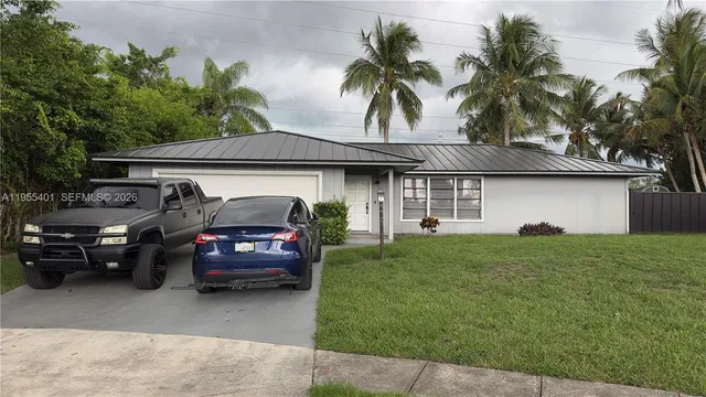 $449,999 | 323 Canterbury Drive West, Riviera Beach, FL 33407