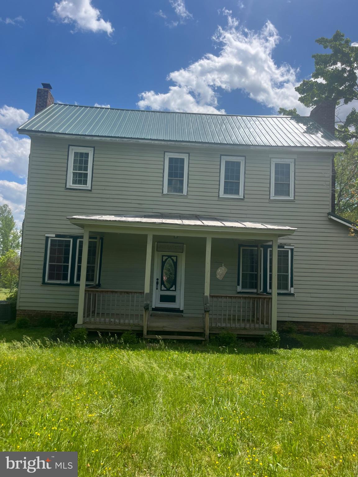 Charming two-story home with porch.