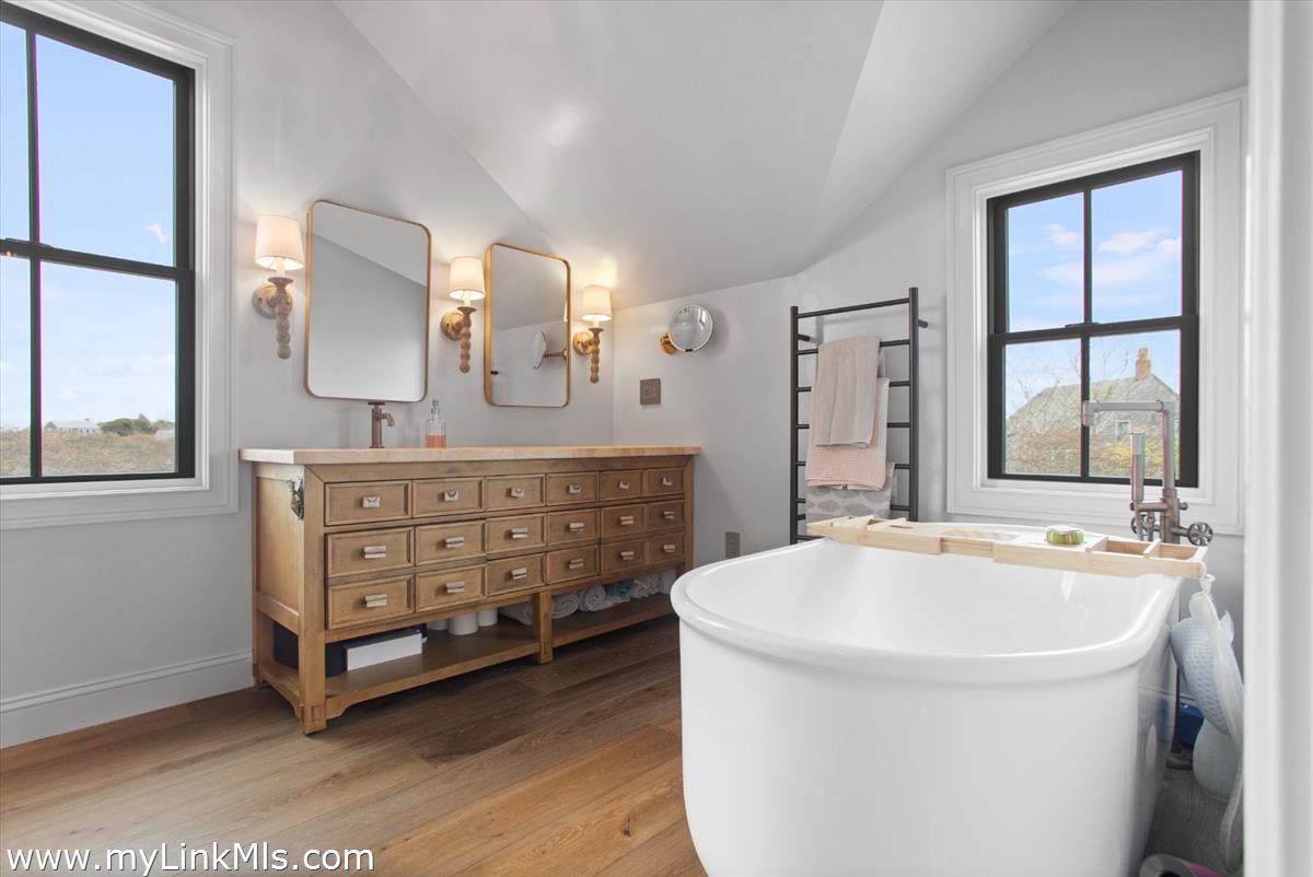 13 Parson Lane Nantucket, MA 02554 - Photo 16 of 44 a spacious bathroom with a tub sink and mirror