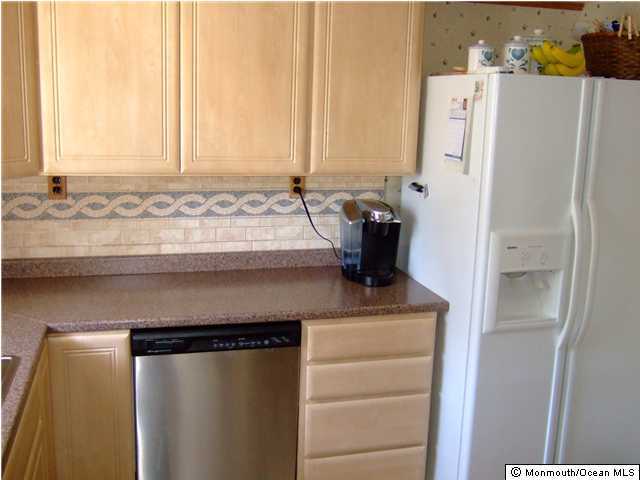 418 Bella Vista Road Brick, NJ 08724 - Photo 3 of 3 a view of a refrigerator in kitchen and a window