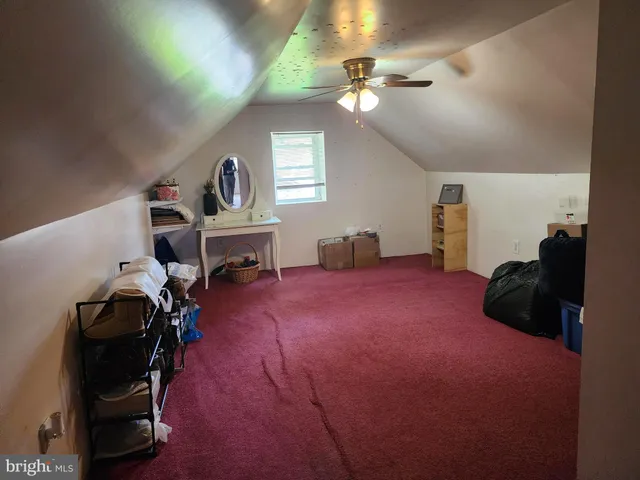 a bedroom with furniture and a chandelier