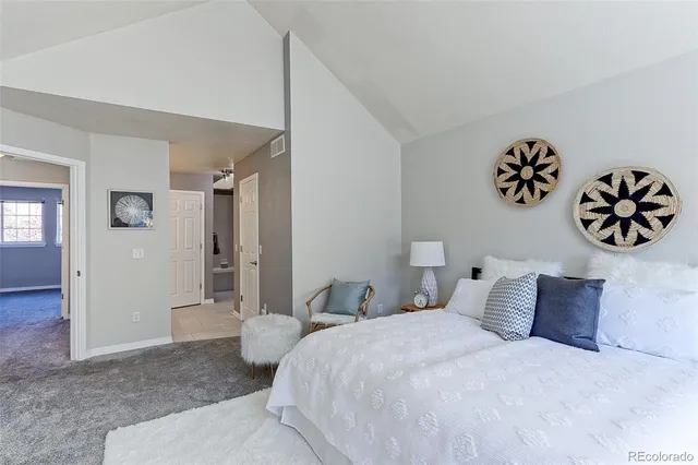 a bedroom with a bed and a table