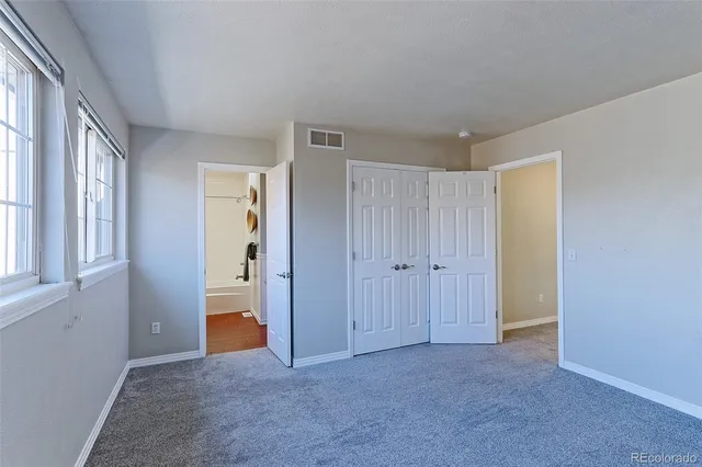 a view of an empty room with a bathroom
