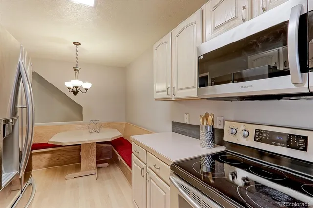 a kitchen with a stove and a microwave