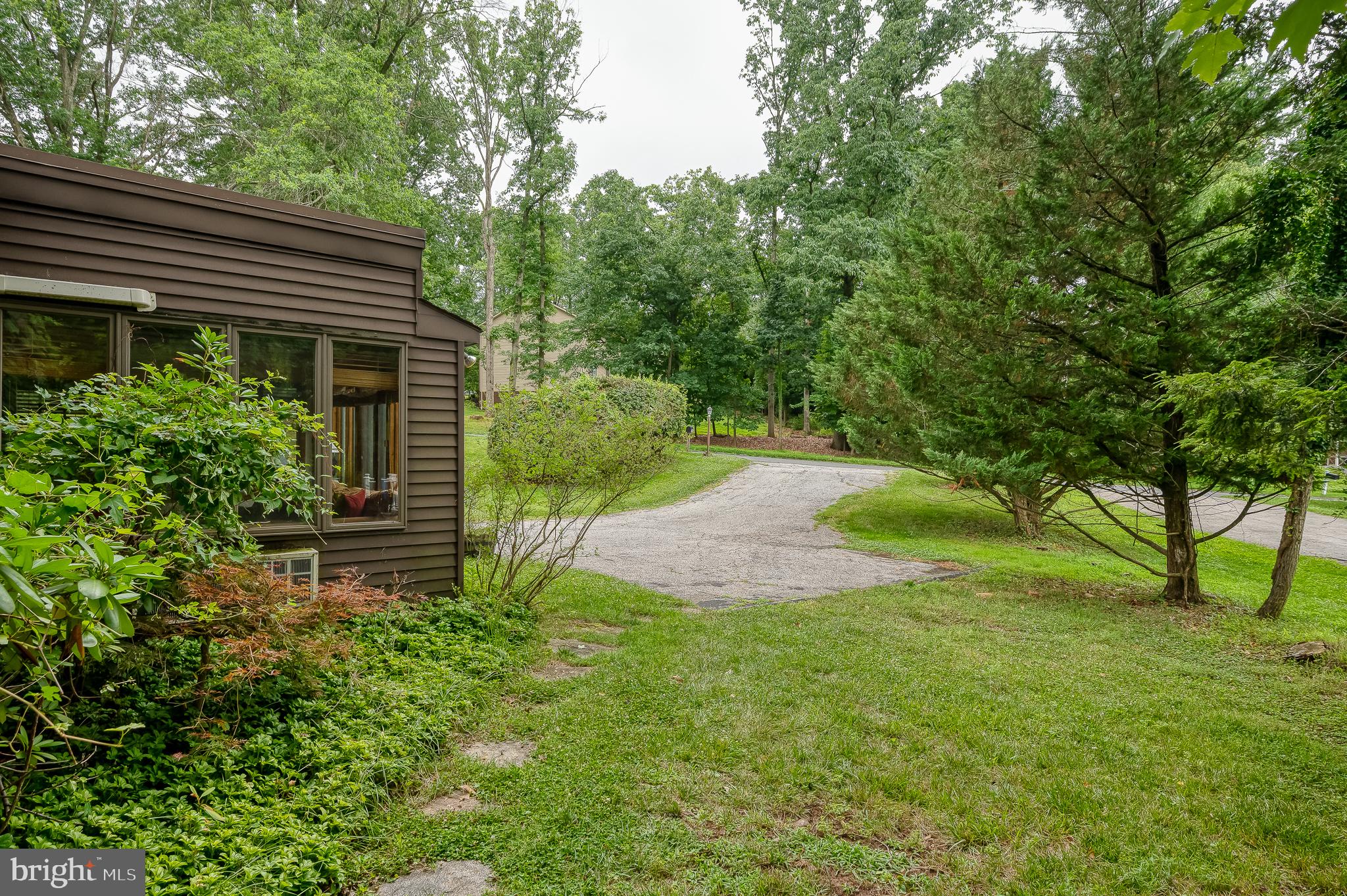 3228 Midfield Road Pikesville, MD 21208 - Photo 37 of 42 Serene pathway through lush greenery.