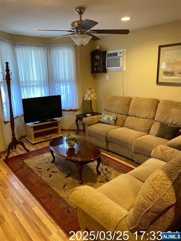 81 Waydell Street Newark, NJ 07105 - Photo 13 of 29 a living room with furniture and a flat screen tv