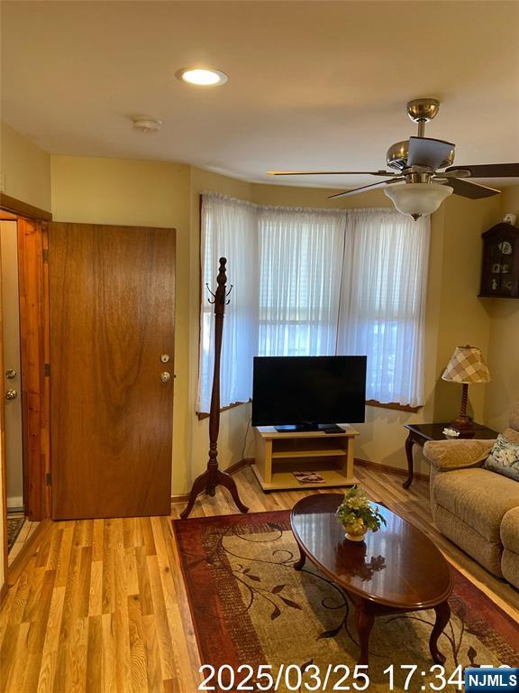 81 Waydell Street Newark, NJ 07105 - Photo 15 of 29 a room with furniture and a flat screen tv