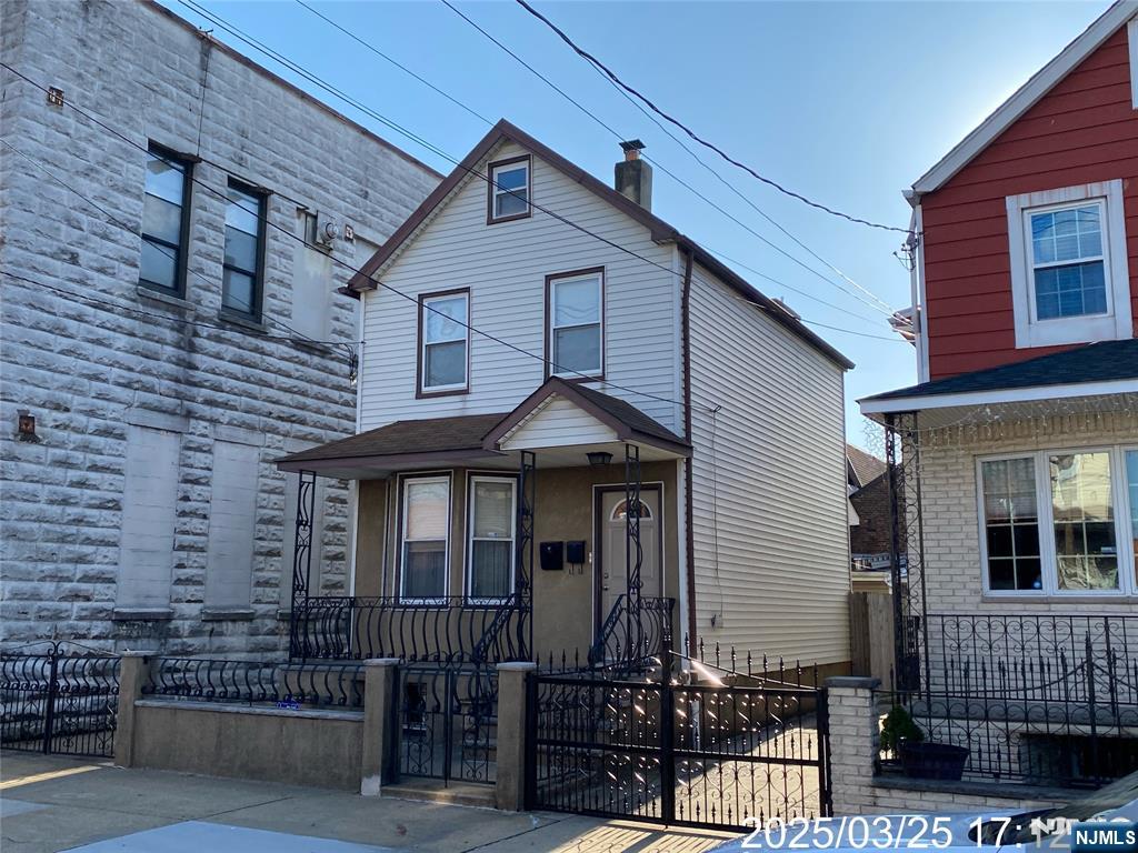 81 Waydell Street Newark, NJ 07105 - Photo 29 of 29 a front view of a house with iron fence