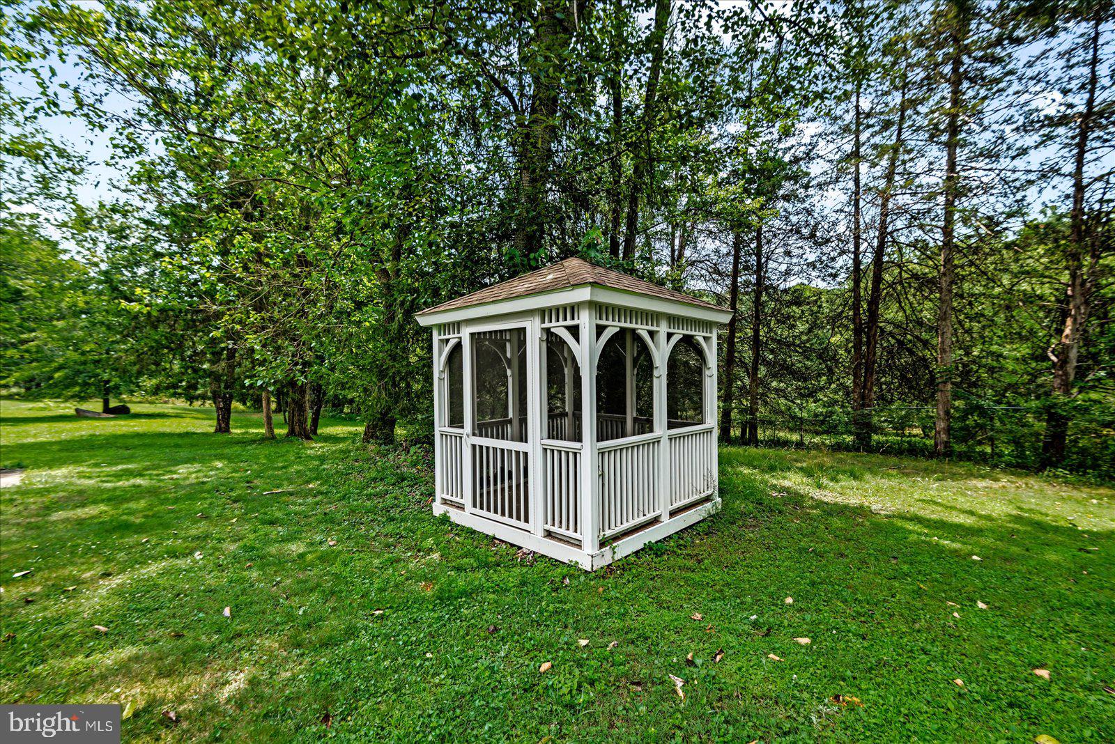 31934 Indiantown Road Locust Grove, VA 22508 - Photo 53 of 84 Charming gazebo nestled in lush greenery.