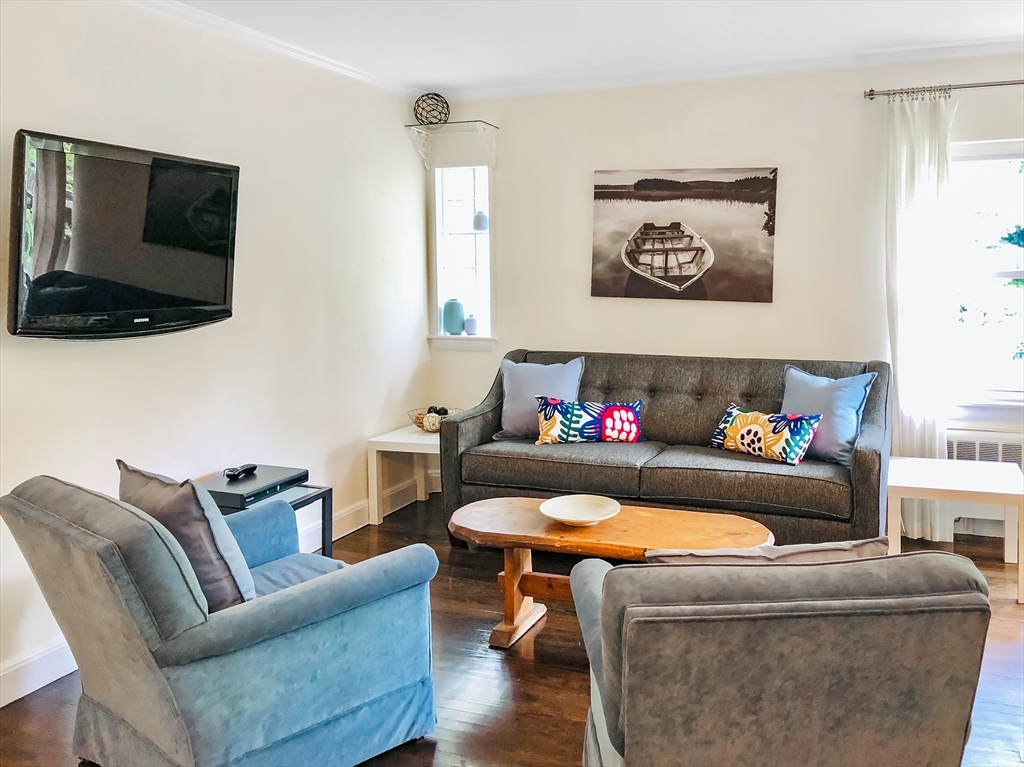 675 Chestnut Hill Avenue Brookline, MA 02445 - Photo 12 of 23 a living room with furniture and a flat screen tv