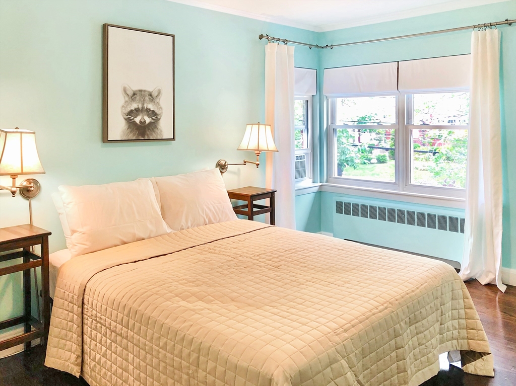 675 Chestnut Hill Avenue Brookline, MA 02445 - Photo 16 of 23 a bedroom with a large bed and a window