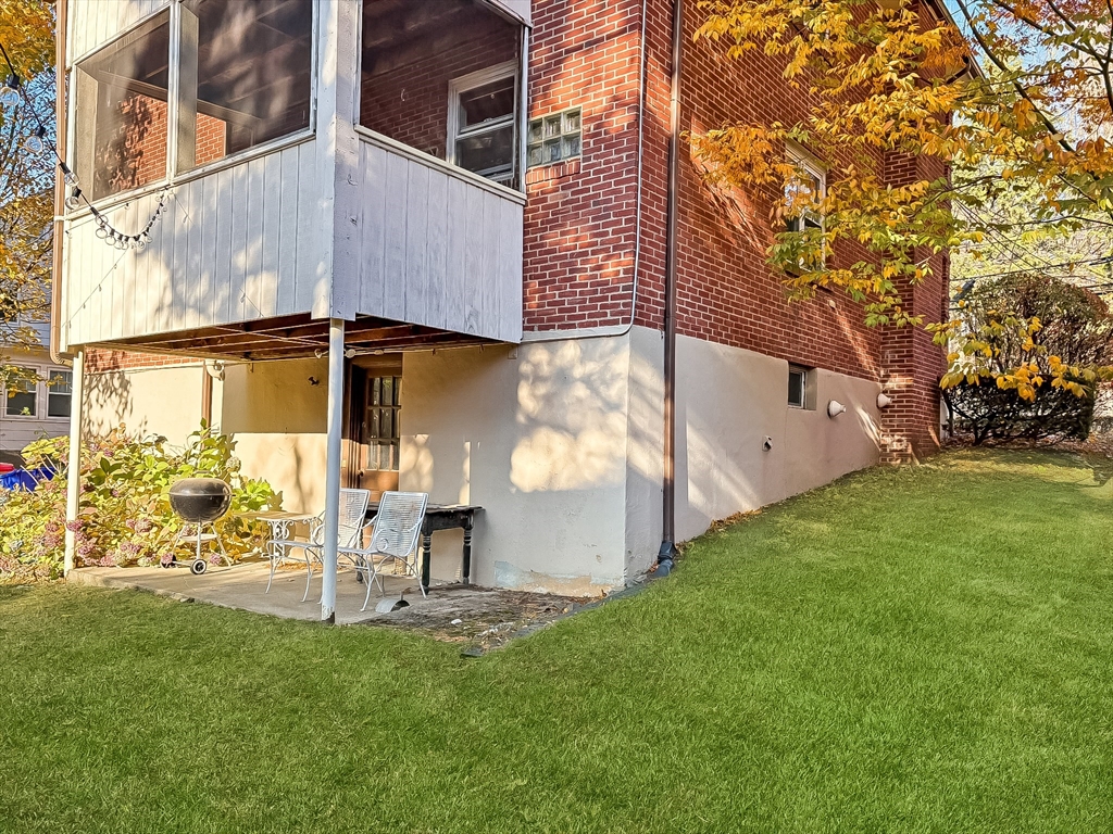 675 Chestnut Hill Avenue Brookline, MA 02445 - Photo 20 of 23 a view of a building with a yard