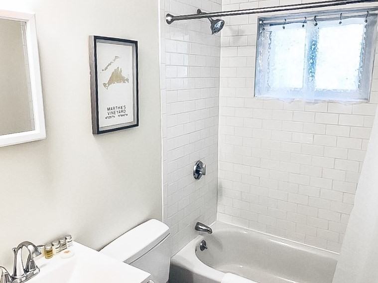 675 Chestnut Hill Avenue Brookline, MA 02445 - Photo 10 of 23 a bathroom with a bathtub and a shower