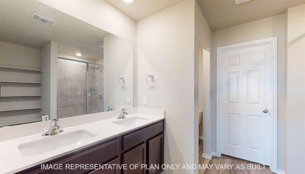 10325 Altair Drive Waco, TX 76708 - Photo 10 of 15 a bathroom with a sink double vanity and a mirror