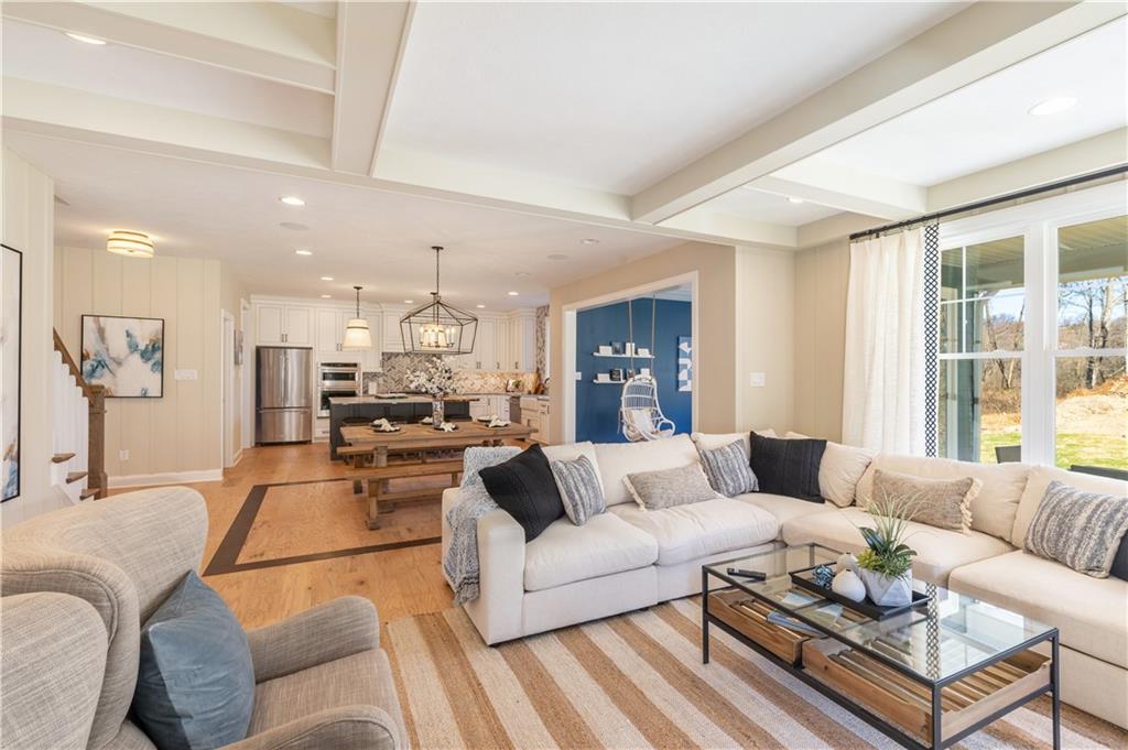 103 Maggie Drive Eighty Four, PA 15330 - Photo 11 of 23 a living room with furniture and a chandelier