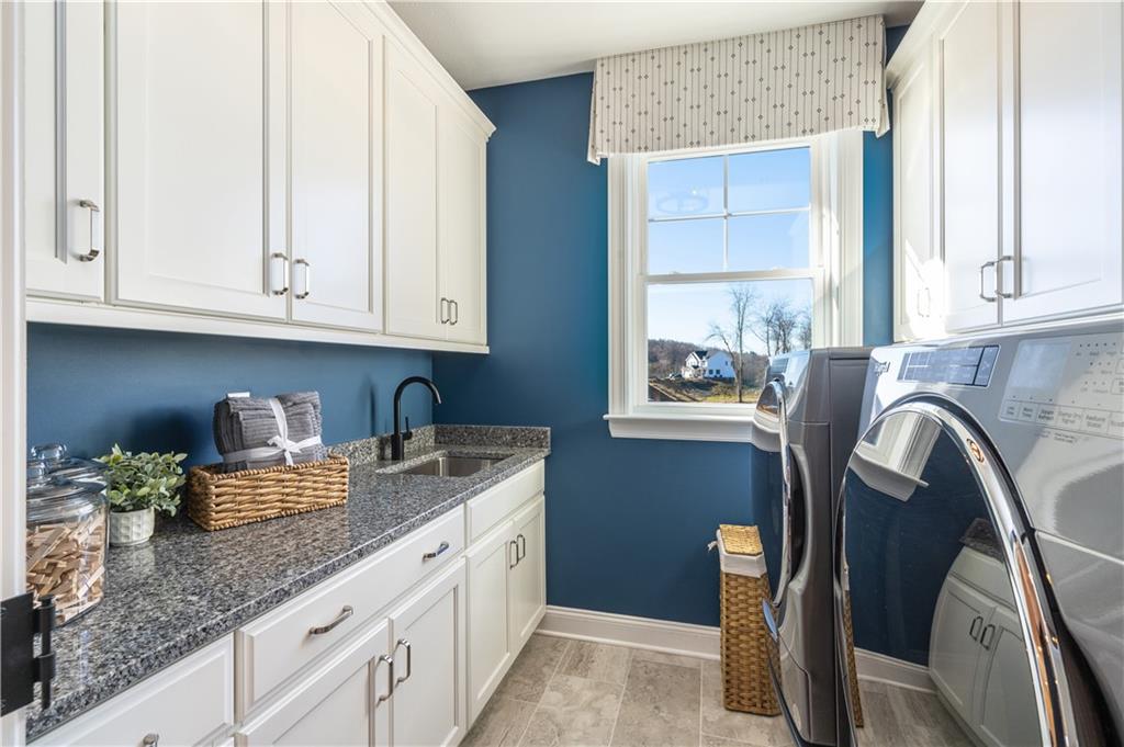 103 Maggie Drive Eighty Four, PA 15330 - Photo 17 of 23 a kitchen with granite countertop a sink stove and cabinets