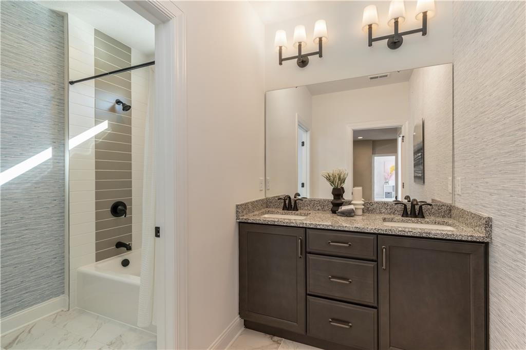 103 Maggie Drive Eighty Four, PA 15330 - Photo 19 of 23 a bathroom with a granite countertop sink mirror and bathtub