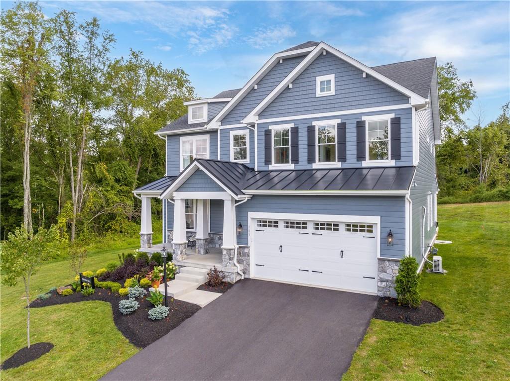 103 Maggie Drive Eighty Four, PA 15330 - Photo 2 of 23 a front view of a house with garden
