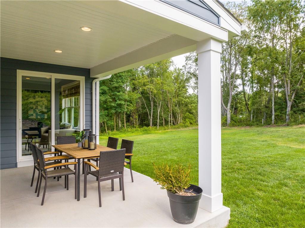 103 Maggie Drive Eighty Four, PA 15330 - Photo 4 of 23 a view of a porch with furniture and garden