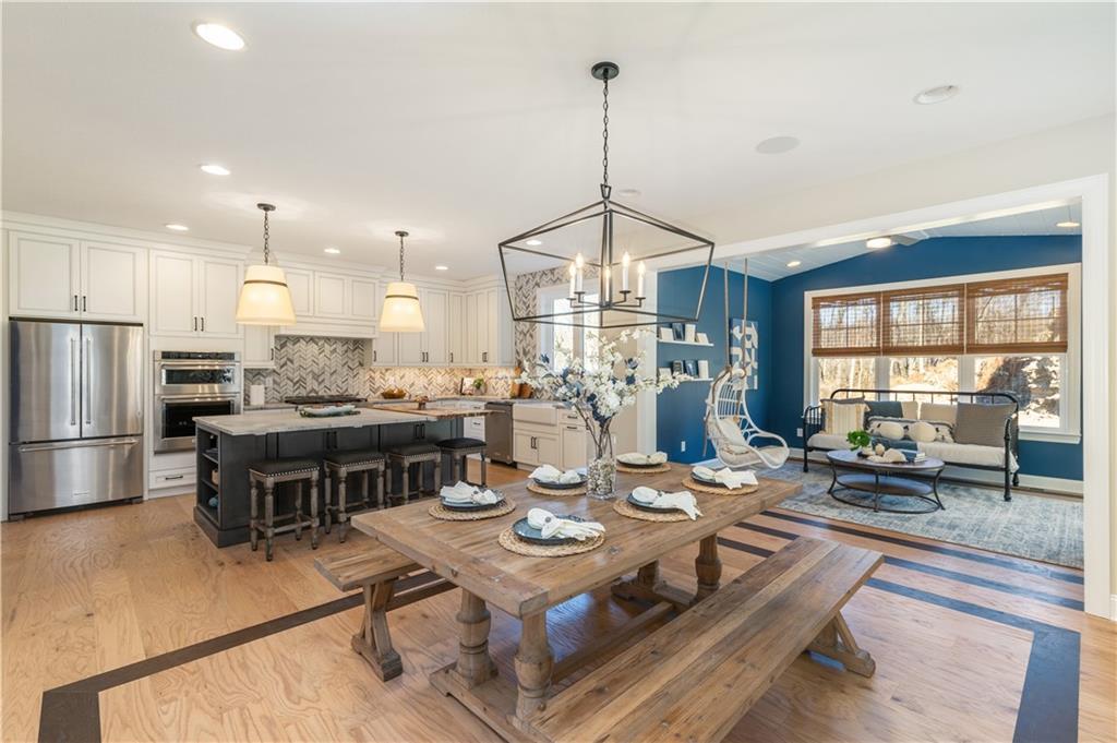 103 Maggie Drive Eighty Four, PA 15330 - Photo 6 of 23 a open kitchen with stainless steel appliances granite countertop a stove and a dining table with chairs