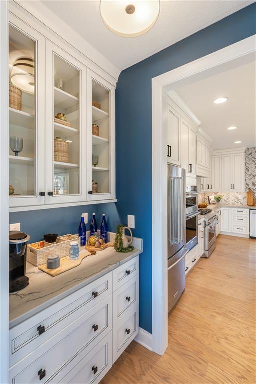 103 Maggie Drive Eighty Four, PA 15330 - Photo 10 of 23 a kitchen with stainless steel appliances kitchen island granite countertop a refrigerator and a sink