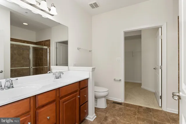 a bathroom with a shower and a sink