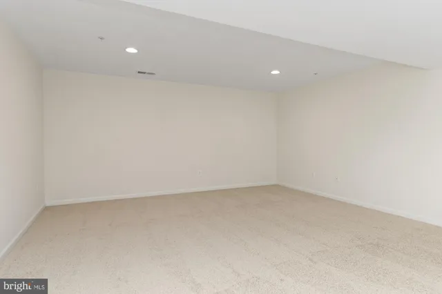 a white toilet sitting next to a white sink