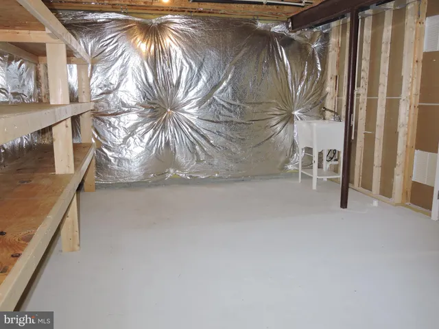 a view of an empty room with furniture