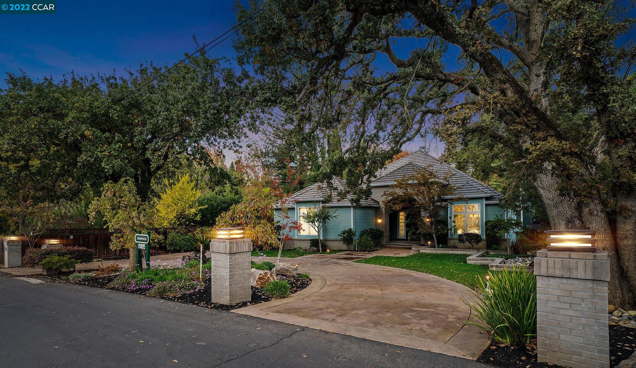 a front view of a building with tree s