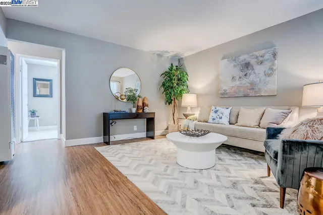 a living room with furniture and a lamp