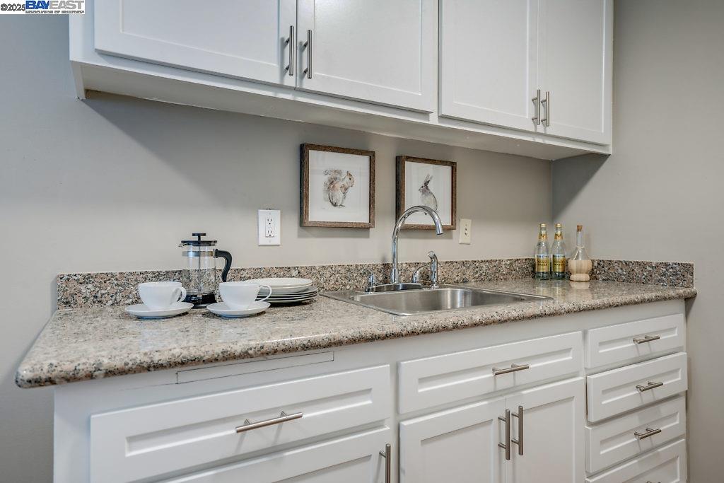 2093 Mt Diablo Street Concord, CA 94520 - Photo 10 of 16 a bathroom with a granite countertop sink and a mirror