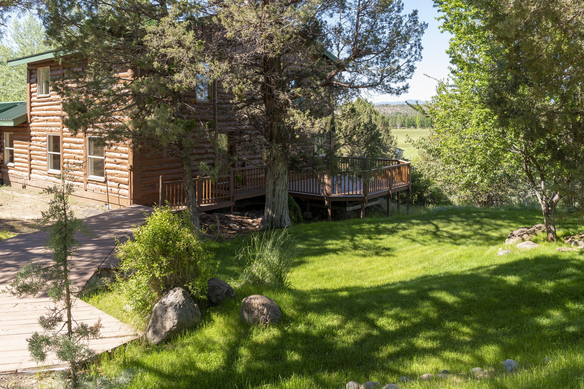 20150 Tumalo Road Bend, OR 97703 - Photo 32 of 53 GRASSY AREA AND DECKS