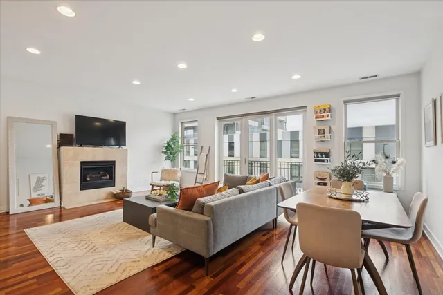 a living room with fireplace furniture and a fireplace