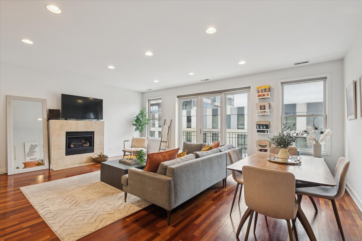 1234 North Milwaukee Avenue, Unit 3 Chicago, IL 60622 - Photo 2 of 16 a living room with fireplace furniture and a fireplace