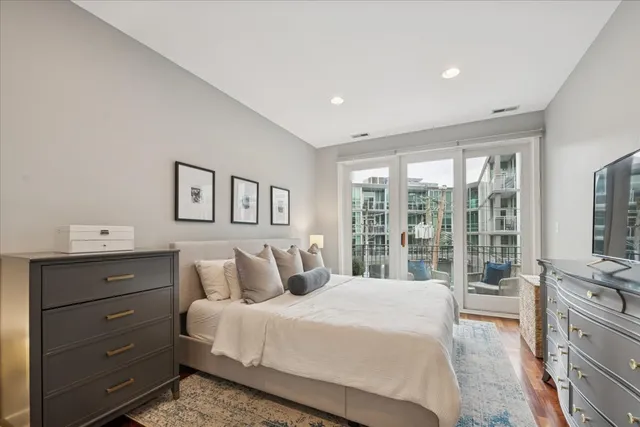 a bedroom with a large bed and a window