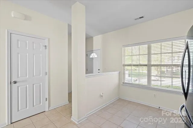 a large kitchen with cabinets and stainless steel appliances