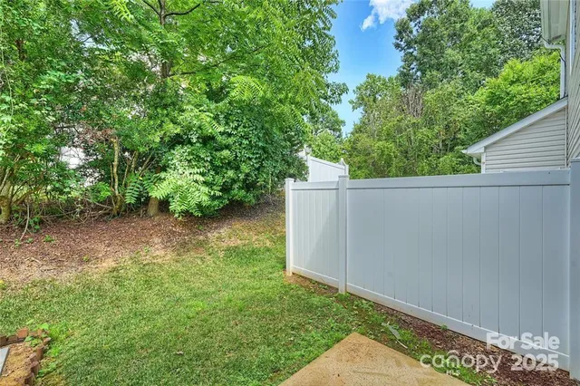a view of a house with swimming pool and sitting area