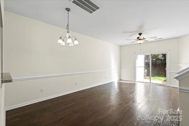a kitchen with stainless steel appliances a refrigerator and a stove