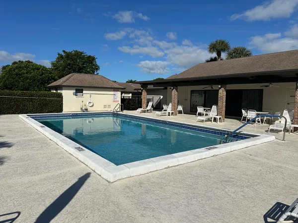 a kitchen with stainless steel appliances granite countertop a sink a refrigerator and a stove