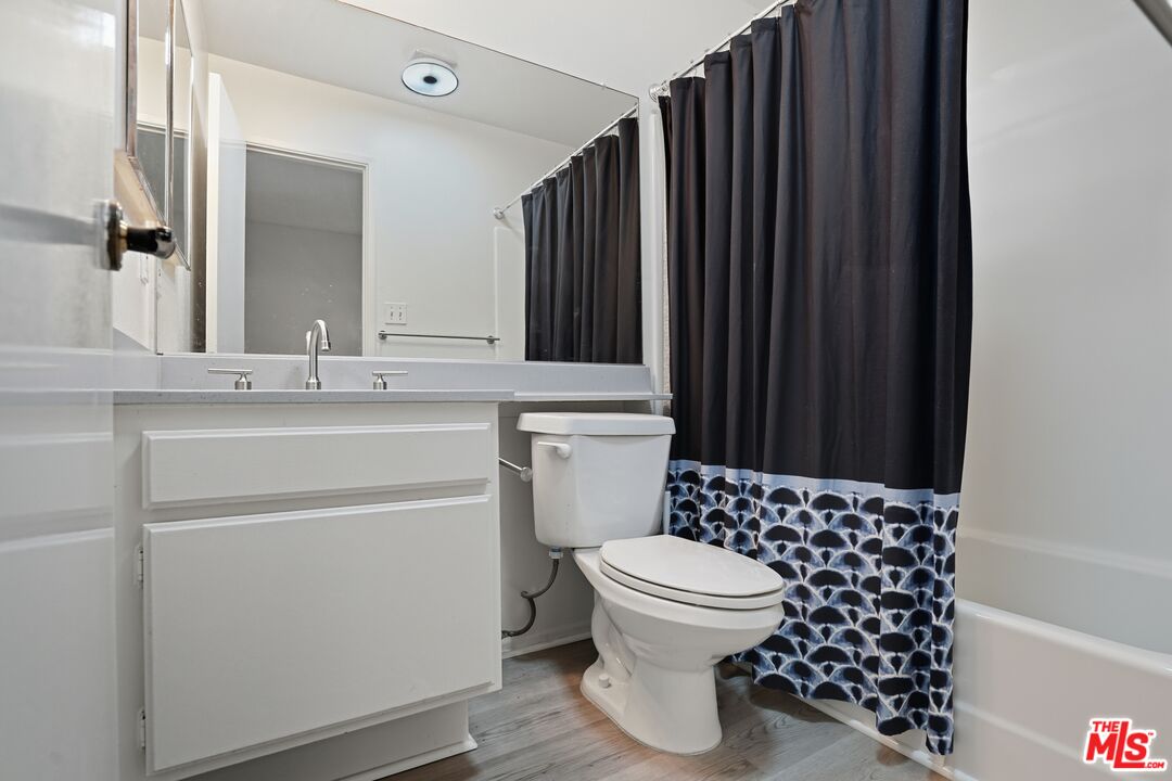 19355 Sherman Way, Unit 42 Reseda, CA 91335 - Photo 22 of 41 a bathroom with a sink a toilet and shower