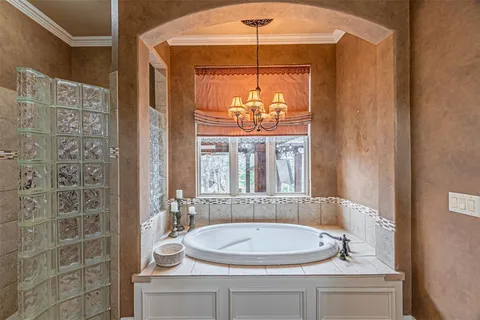 a bathroom with a granite countertop sink and a large mirror