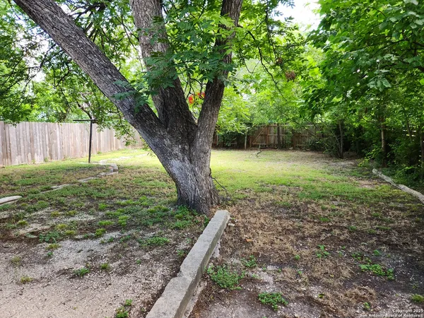 a backyard of a house with lots of green space