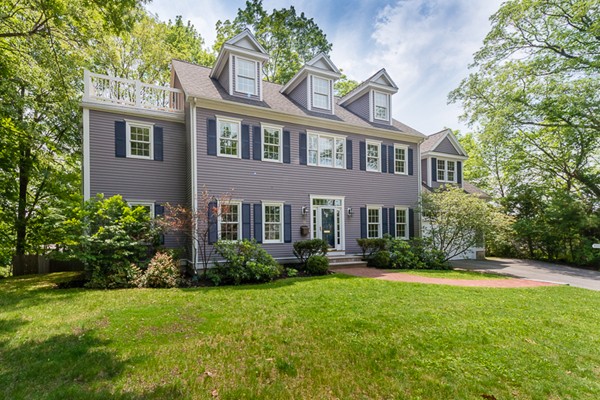 11 Oakland Street Lexington, MA 02420 - Photo 1 of 30 a front view of a house with garden and porch