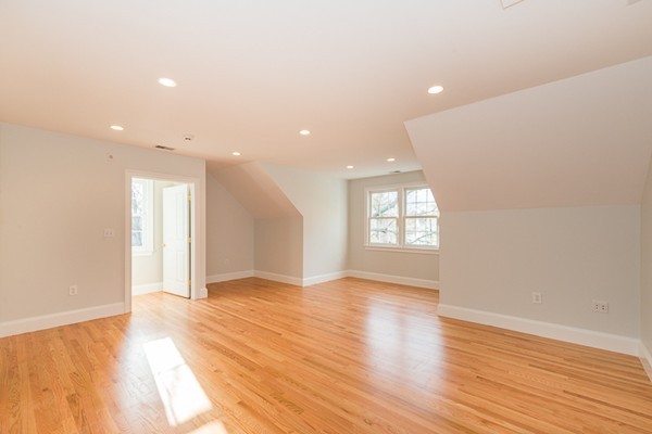 11 Oakland Street Lexington, MA 02420 - Photo 16 of 30 a view of an empty room with wooden floor and a window
