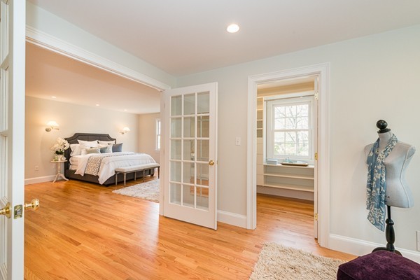 11 Oakland Street Lexington, MA 02420 - Photo 19 of 30 a bedroom with a bed and a window